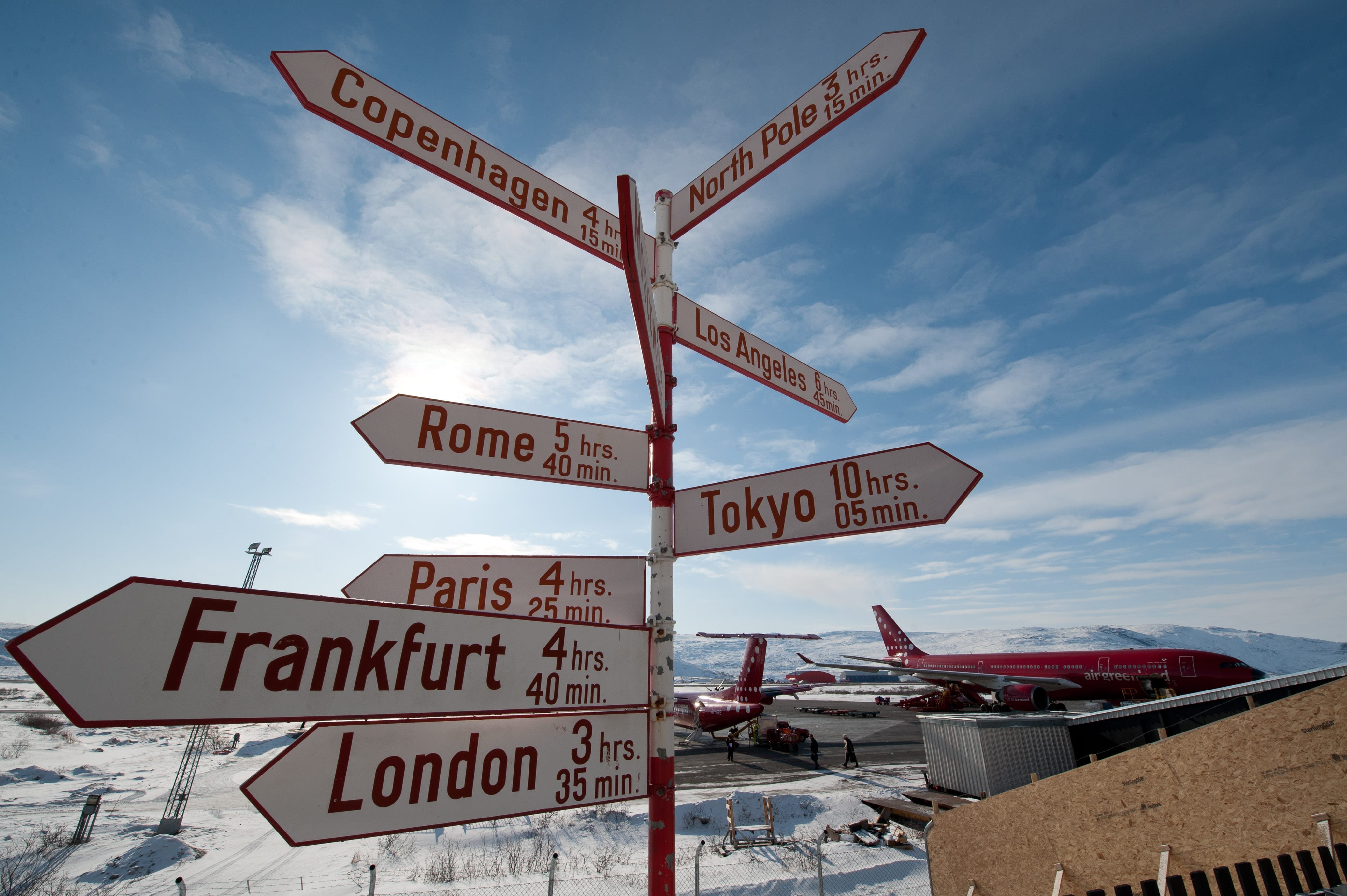 Sign in Kangerlussuaq pointing to international cities around the world